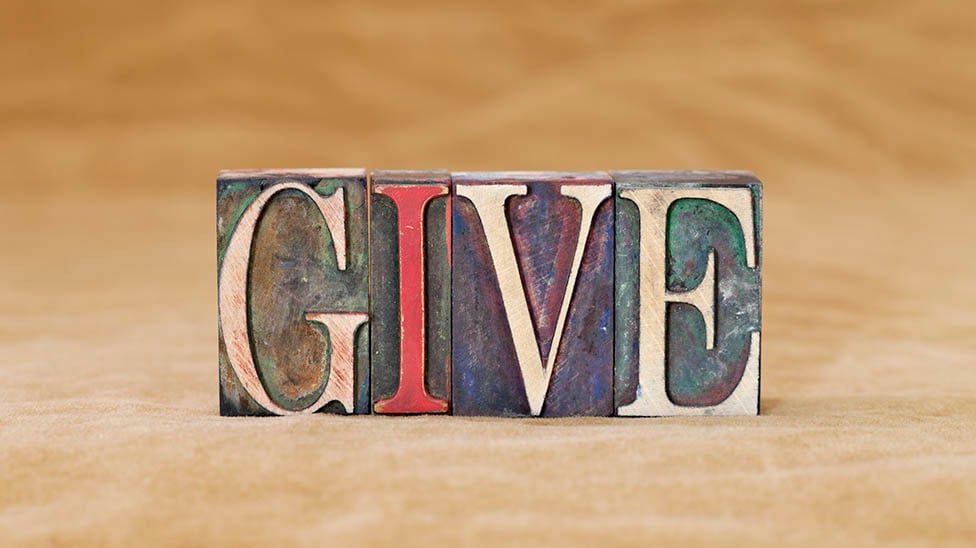 Blocks of the letters from the word give.
