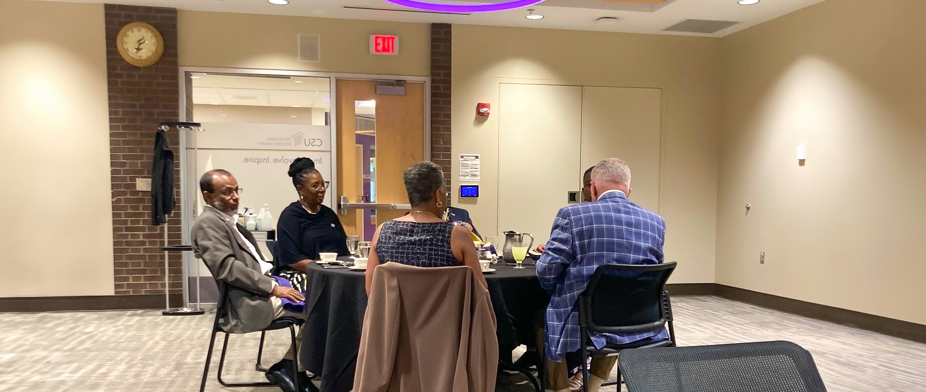 a group of people sitting at a table