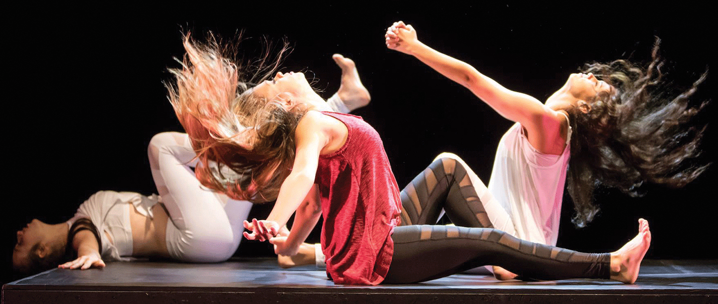 Dance students on stage doing a dance performance