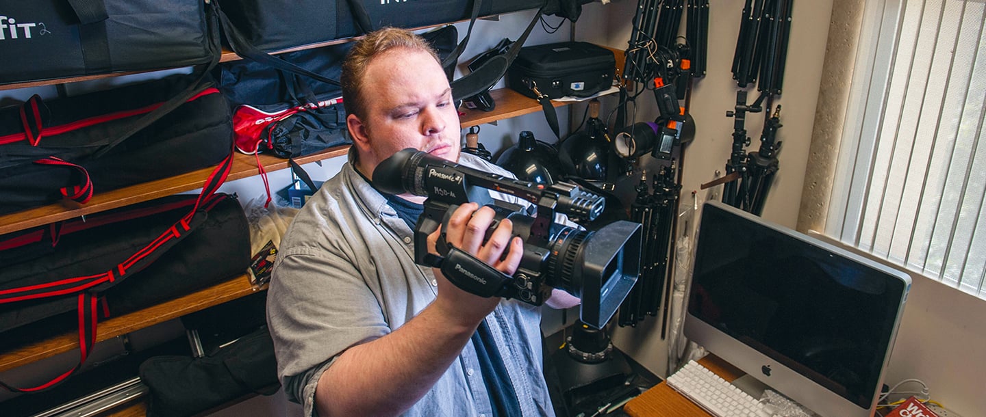 a person holding a video camera