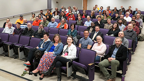 a group of people sitting in chairs