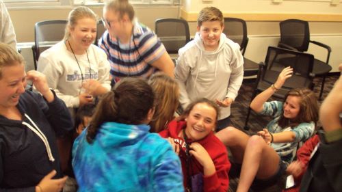 ETS students laughing in a classroom