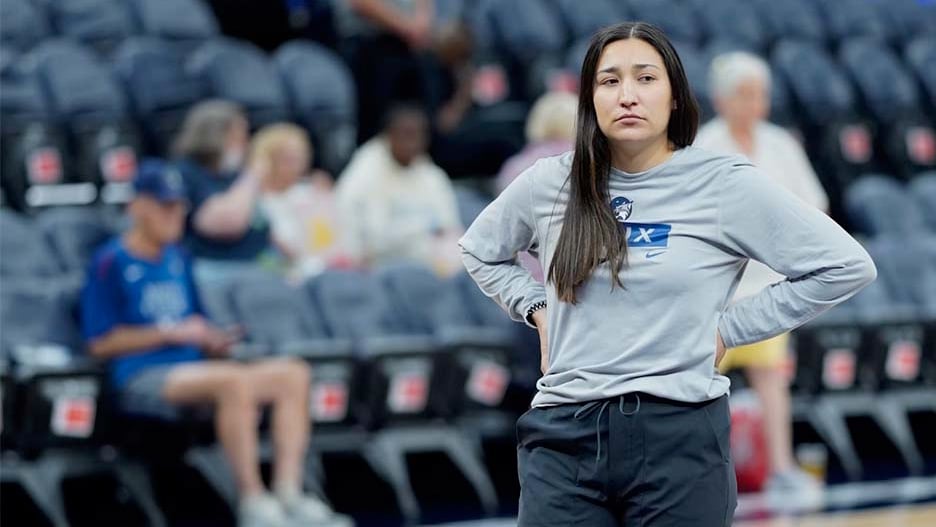 Minnesota Lynx Assistant Athletic Trainer Brandi BlueArm leading the team through wamups on the court pregame