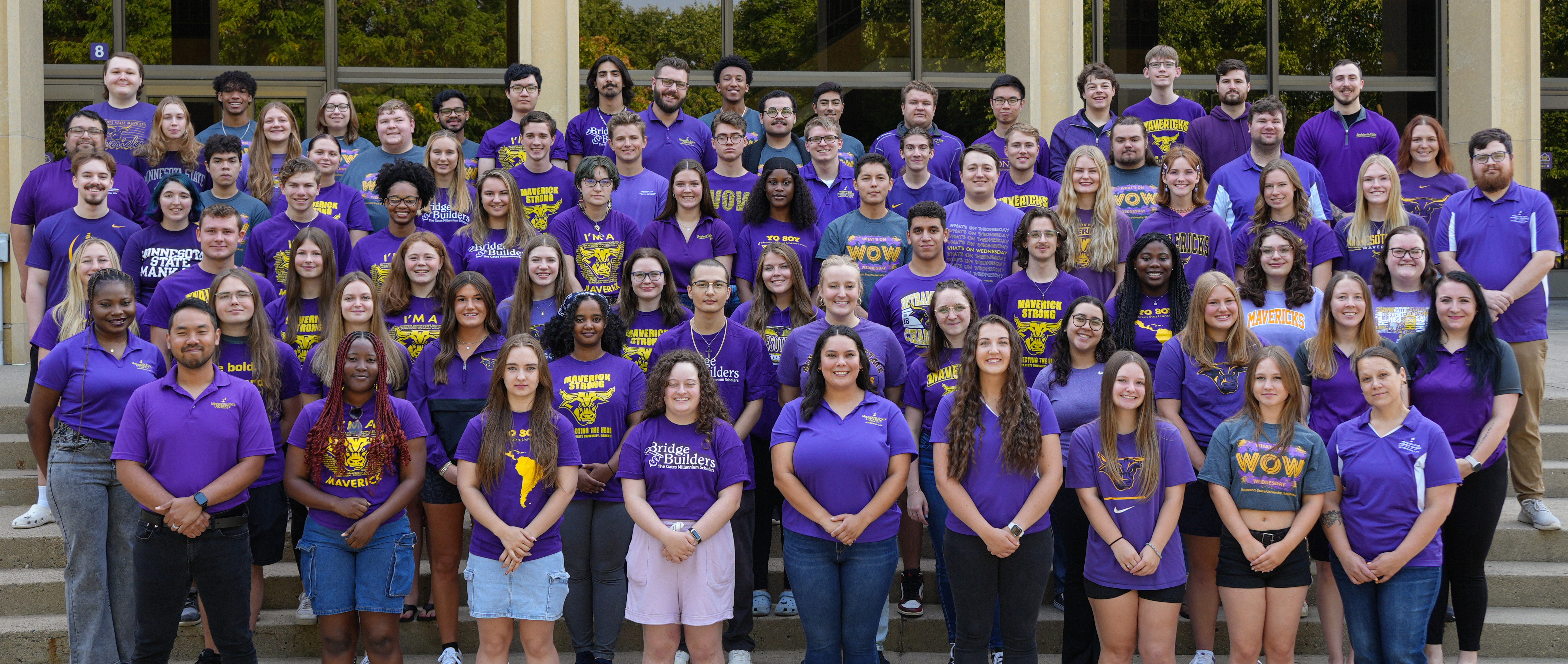 a group of people in purple shirts