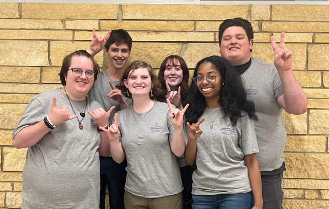 a group of people posing for a photo